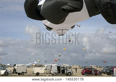 LAKOLK DENMARK - SEPTEMBER 3 2016: Colorful kites on the big beach on Lakolk Romo. International Kite Festival for the 27th time. September 3 2016.