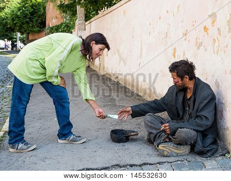 Uzhhorod, Ukraine -  August 21, 2016: Poor Man Begging For Alms Near The Church