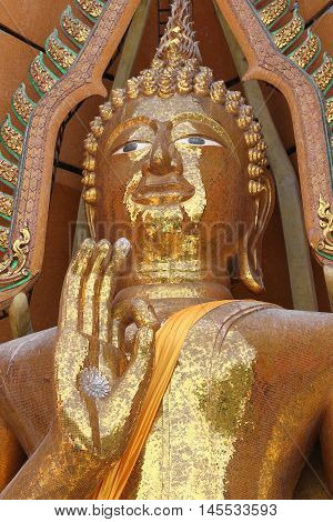 Gold Buddha statue (Luang por shin pa tan porn) in Thailand temple at Kanchanaburi temple (Wat Tham Sua).
