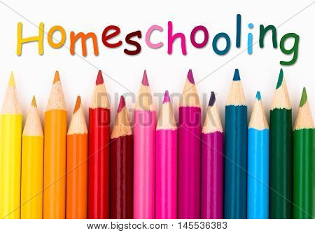 Pencil Crayons with text Homeschooling isolated over white