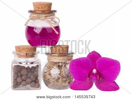 Pink orchid and bottles. Spa concept. Isolated on white.