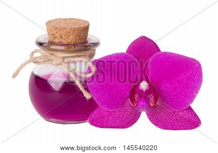 Pink orchid and bottle of oil. Spa concept. Isolated on white.