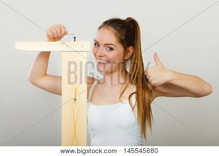 Success Ful Woman Assembling Furniture. Diy.