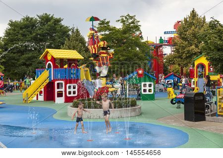 GUNZBURG GERMANY - AUG 18 2016: Children playing in a fountain at the Lego themed park Legoland Deutschland in Guenzburg Baden Wurtemberg Germany