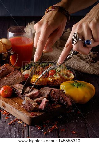Grilled Steak Sliced On A Cutting Board.