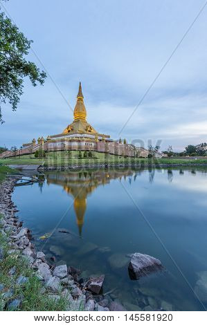 Famous Maha Mongkol Bua Pagoda In Roi-ed Thailand At Sunset.
