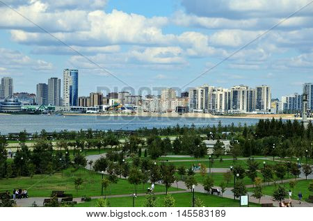 Kazan, Tatarstan, Russia - September 4, 2016. A view of the Kremlin embankment of the river Kazanka. Right and left bank of the Kazanka River. New Savinovskij district.