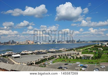 Kazan, Tatarstan, Russia - September 4, 2016. A view of the Kremlin embankment of the river Kazanka. Right and left bank of the Kazanka River. New Savinovskij district.