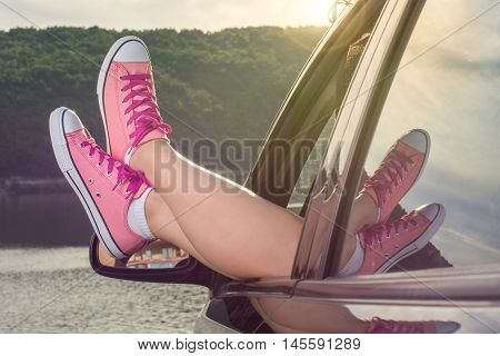 Legs Out Of The Car Window By The Lake