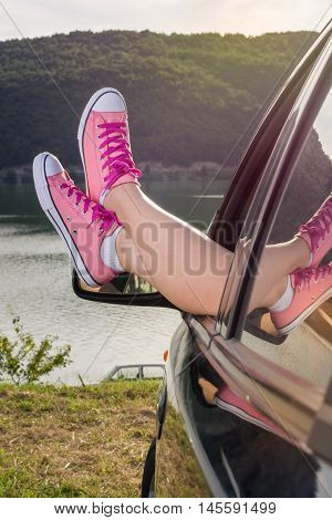 Legs Out Of The Car Window By The Lake