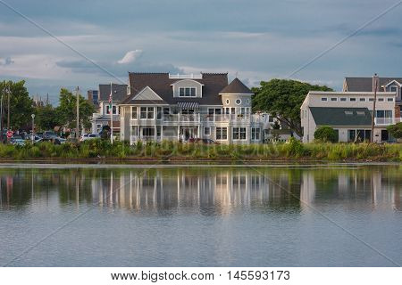 House and its reflections in a lake along the Jersey shore