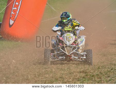 Unidentified Racer Rides A Quad Motorbike.