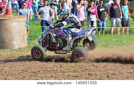 Unidentified Racer Rides A Quad Motorbike.