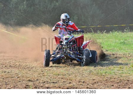 Unidentified Racer Rides A Quad Motorbike.