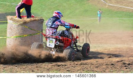 Unidentified Racer Rides A Quad Motorbike.