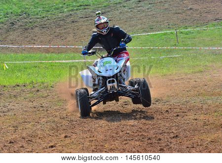 Unidentified Racer Rides A Quad Motorbike.