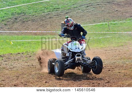 Unidentified Racer Rides A Quad Motorbike.
