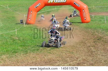 Unidentified Racer Rides A Quad Motorbike.