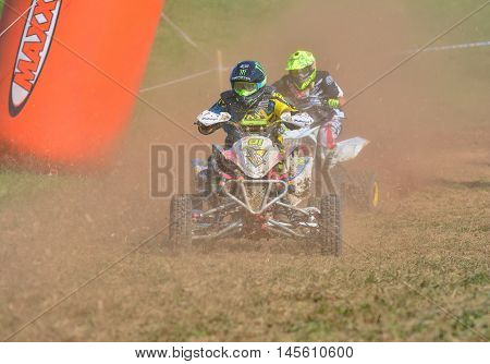 Unidentified Racer Rides A Quad Motorbike.