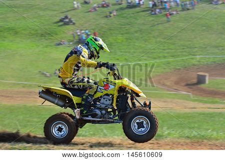 Unidentified Racer Rides A Quad Motorbike.