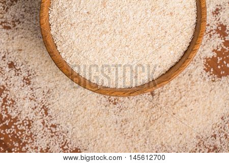 Farinha de Mandioca. Manioc. Cassava flour over a wooden table