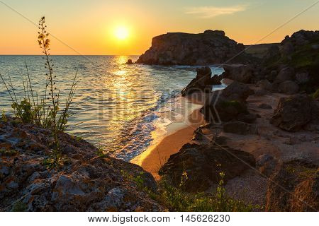 Sun rises over the Sea of Azov on Generals beach. Karalar regional landscape park in the Crimea.