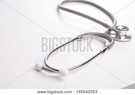 Grey stethscope isolated on white background with lighting
