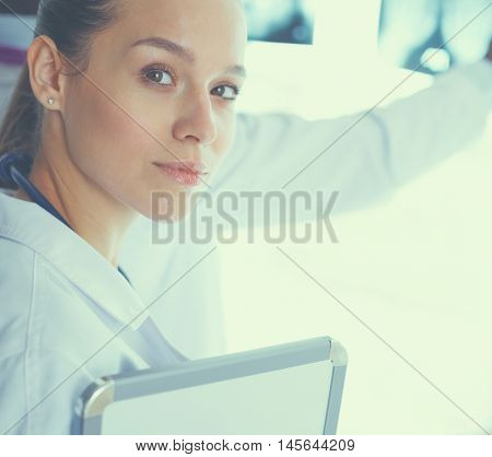 Doctors analyzing an x-ray in a meting