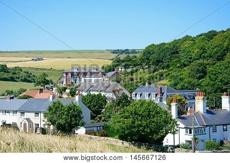 LULWORTH COVE, UNITED KINGDOM - JULY 19, 2016 - Elevated view of village cottages and houses Lulworth Cove Dorset England UK Western Europe, July 19, 2016.