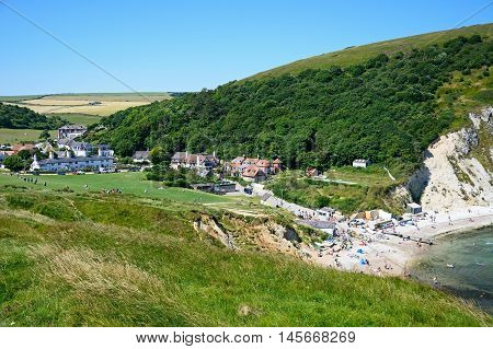 LULWORTH COVE, UNITED KINGDOM - JULY 19, 2016 - Elevated view of the beach and town surrounded by countryside Lulworth Cove Dorset England UK Western Europe, July 19, 2016.