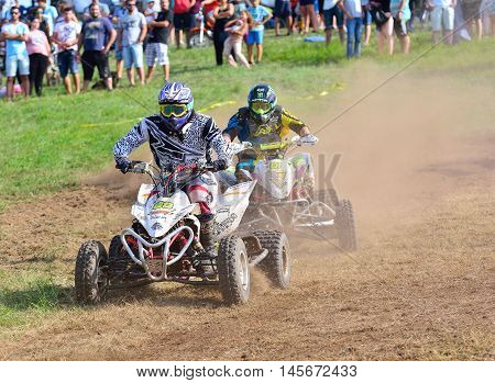 Unidentified Racer Rides A Quad Motorbike.