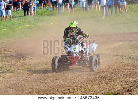 Unidentified Racer Rides A Quad Motorbike.