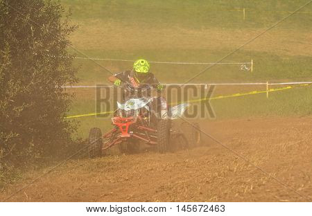 Unidentified Racer Rides A Quad Motorbike.