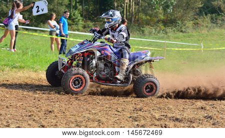 Unidentified Racer Rides A Quad Motorbike.