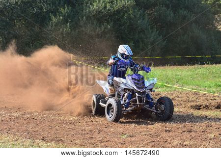 Unidentified Racer Rides A Quad Motorbike.