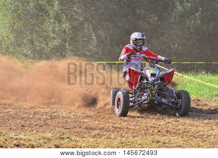 Unidentified Racer Rides A Quad Motorbike.