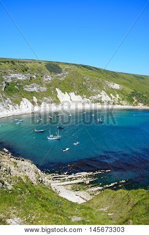 LULWORTH COVE, UNITED KINGDOM - JULY 19, 2016 - Elevated view of boats moored in the cove Lulworth Cove Dorset England UK Western Europe, July 19, 2016.