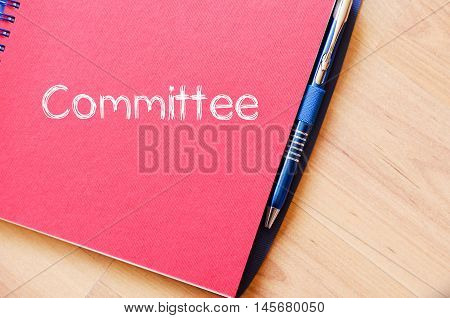 Committee text concept write on notebook .