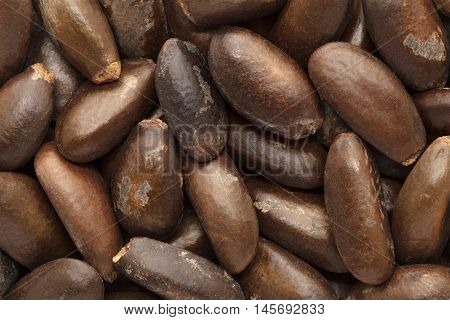 Organic Custard apple or Sugar apple (Annona squamosa) seeds. Macro close up background texture. Top view.