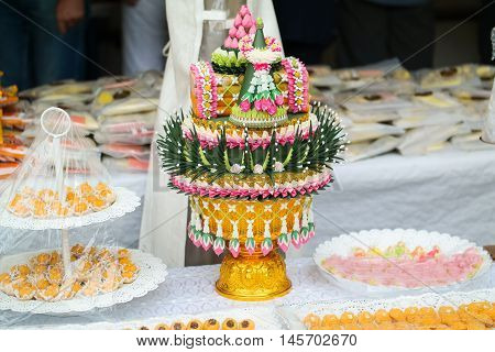 Festive table decoration with decorative fancy cake and sweet desserts