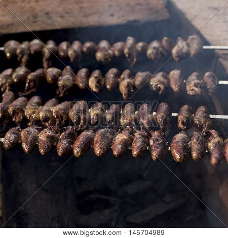 Churrasco, Traditional Brazilian Barbecue, Chicken Hearts Grilled Kebabs.