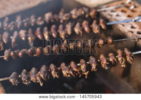 Churrasco, Traditional Brazilian Barbecue, Chicken Hearts Grilled Kebabs.