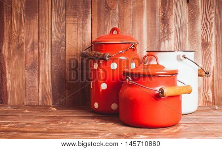 Red and white  vintage kitchen utensils on a white table
