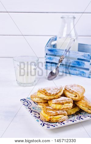 Homemade buns stuffed with cottage cheese on a wooden background. Selective focus.