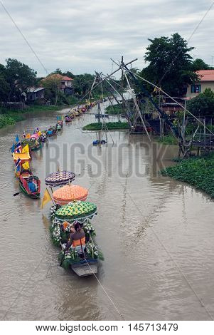 AYUTTHAYA, THAILAND - JULY 15, 2011 : Beautiful flower boats in floating parade, the unique annual Lad Chado candle floating festival of Buddhist lent on July 15, 2011 in Lad Chado canal, Ayutthaya Province, Middle  of  Thailand.