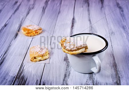 Homemade buns stuffed with cottage cheese on a wooden background. Selective focus.