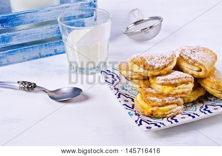 Homemade buns stuffed with cottage cheese on a wooden background. Selective focus.