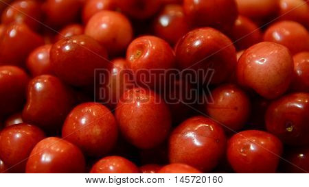 Red cherry background. Red ripe delicious cherries