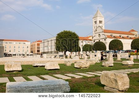 ZADAR CROATIA - SEPTEMBER 6 2012: The Roman Forum and St. Mary's Church in Zadar. Zadar is a city in Croatia the historical center of Dalmatia. The city is situated on the Adriatic Sea. The Roman Forum is the largest on the eastern side of the Adriatic fo