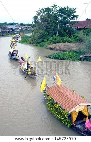 AYUTTHAYA, THAILAND - JULY 15, 2011 : Beautiful flower boats in floating parade, the unique annual Lad Chado candle floating festival of Buddhist lent on July 15, 2011 in Lad Chado canal, Ayutthaya Province, Middle  of  Thailand.